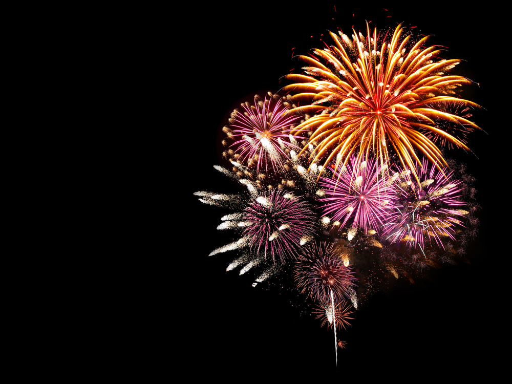 Colorful fireworks lighting up the night sky — pet anxiety and fireworks safety tips for dogs and cats